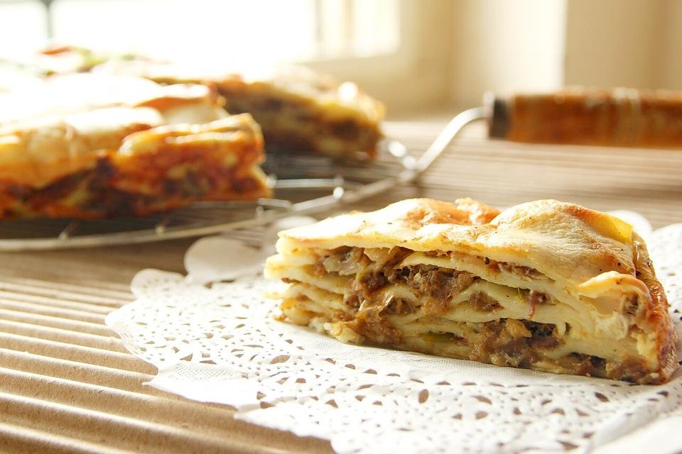 A slice of layered Chatti pathiri on a doily