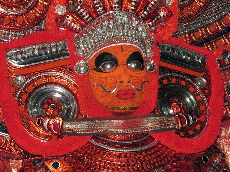 Close view of the Bhairavan Theyyam face and headdress