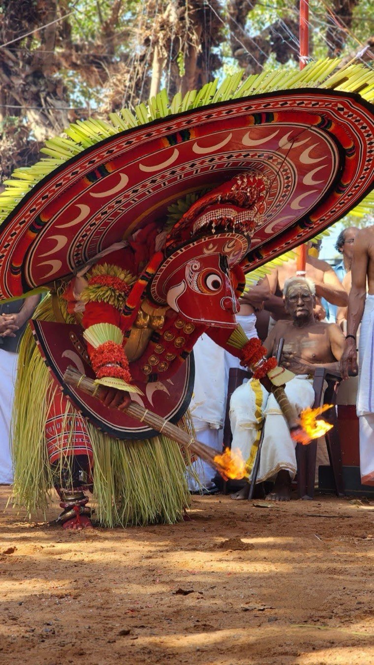 Close view of the Kundora Chamundi Theyyam face and headdress