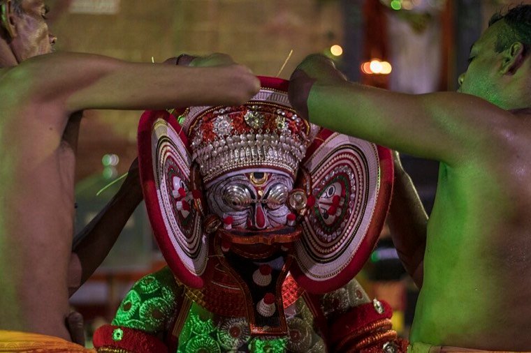 Kuttichathan Theyyam during a ritual in North Malabar, Kerala