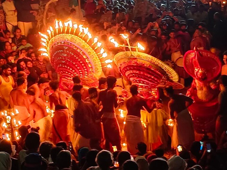 Close view of the Kadangot Makkam Theyyam face and headdress