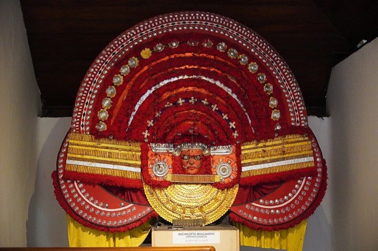 Close view of the Muchilot Bhagavathi Theyyam face and headdress