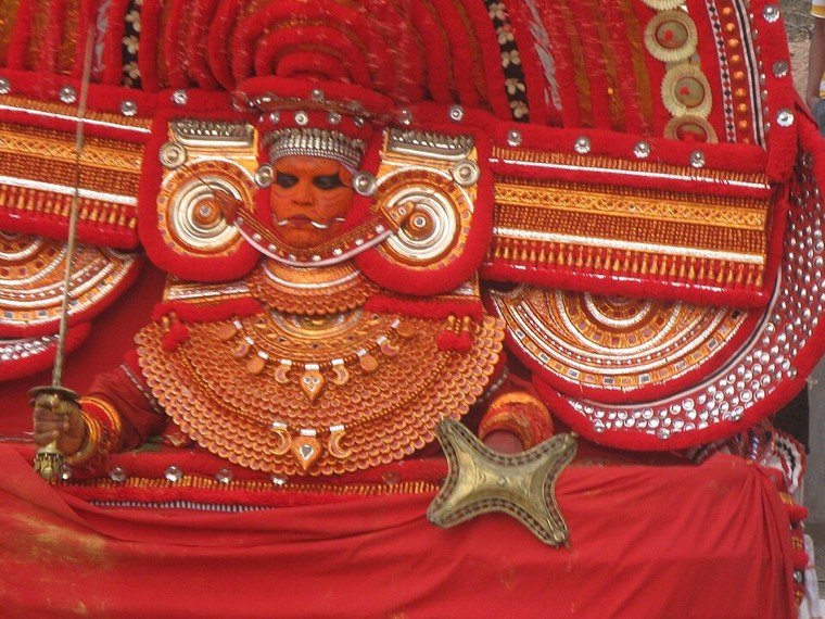 Muchilot Bhagavathi Theyyam during a ritual in North Malabar, Kerala