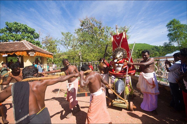 Close view of the Panjuruli Theyyam face and headdress