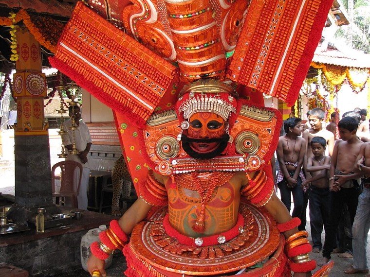 Close view of the Poomaruthan Theyyam face and headdress