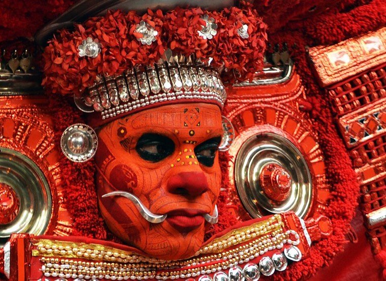Close view of the Puliyoor Kali Theyyam face and headdress