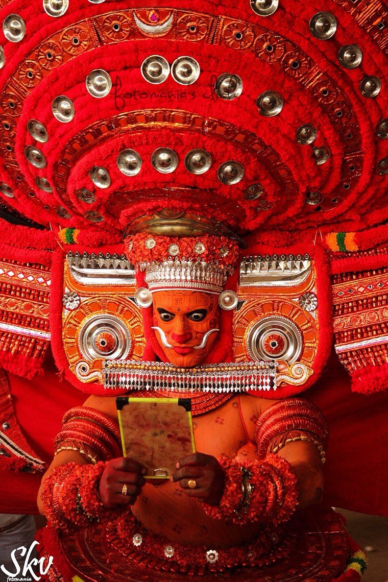 Puliyoor Kali Theyyam during a ritual in North Malabar, Kerala