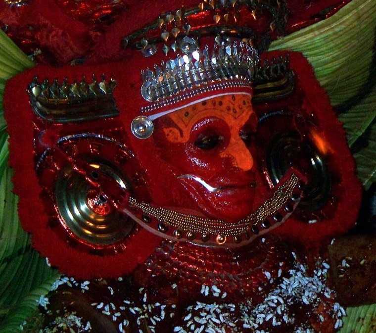 Close view of the Puthiya Bhagavathi Theyyam face and headdress