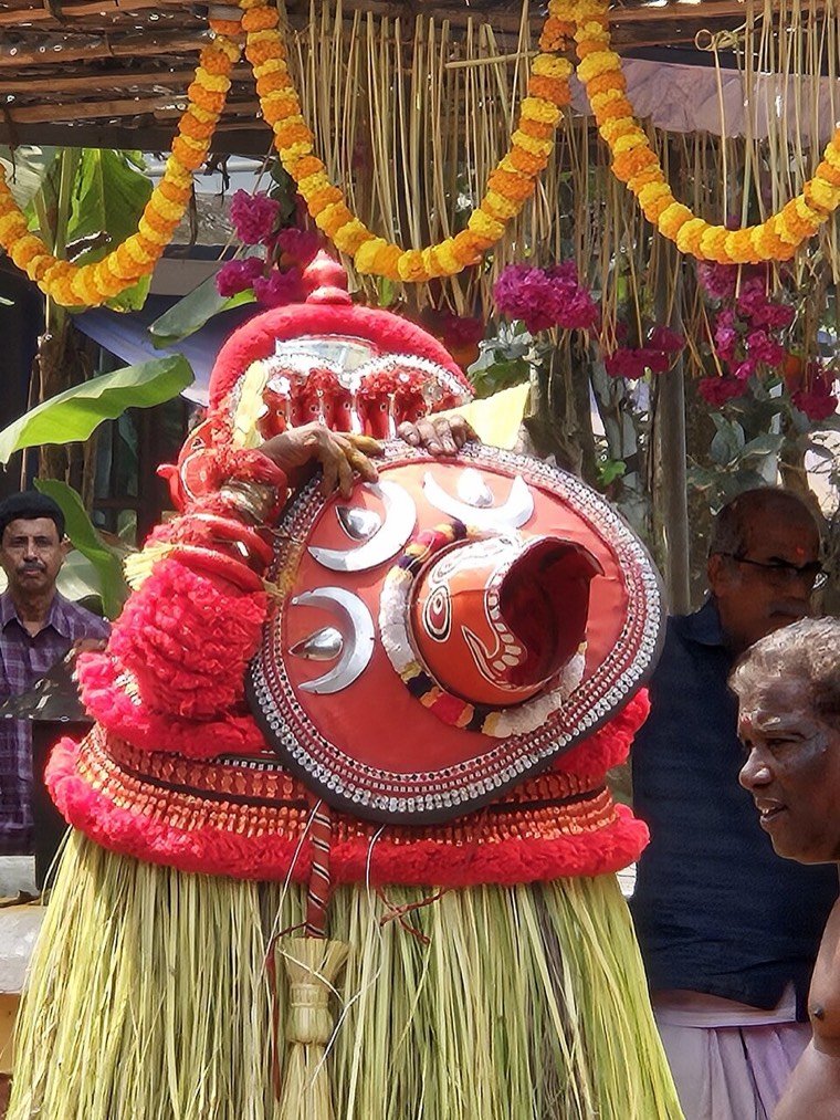 Vishnumoorthi Theyyam during a ritual in North Malabar, Kerala